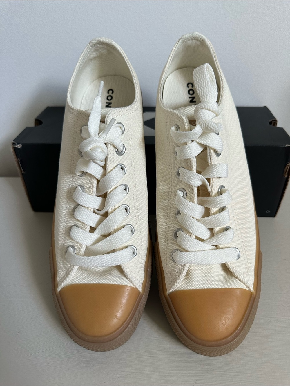 Converse Low Top Sneakers in Cream with Tan Toe Cap